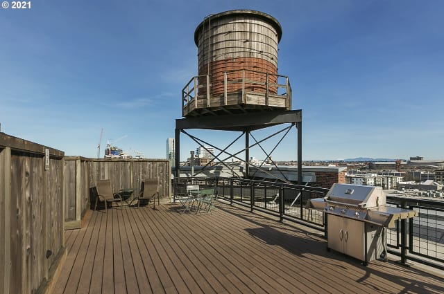 Rooftop deck with BBQ area and city views